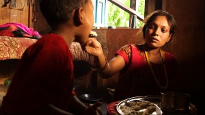 When Januka isn't working in the fields, she is usually crouched on her kitchen floor, cooking food or feeding her family.